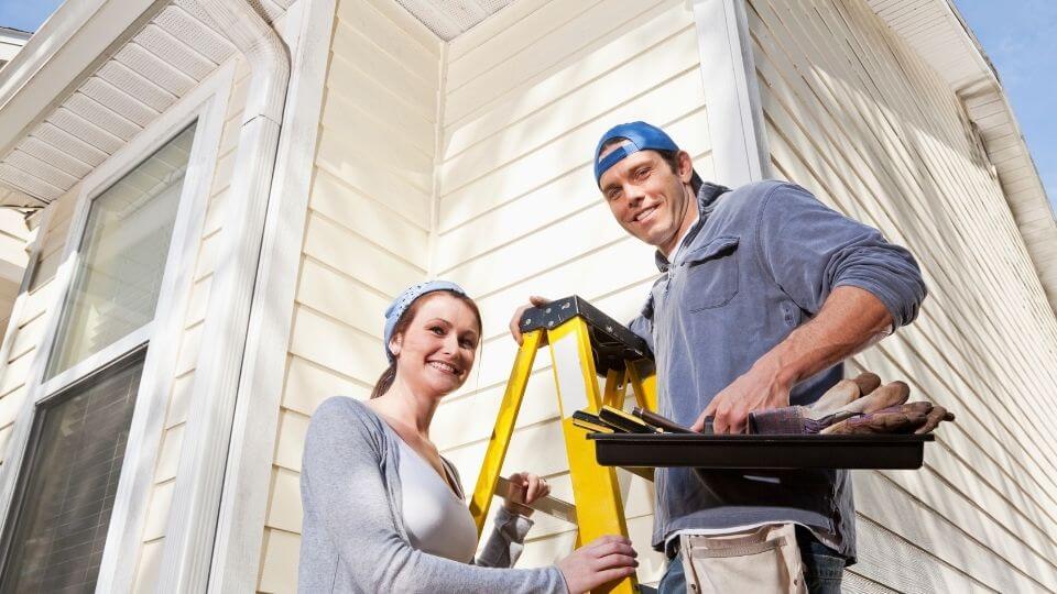 man and woman on ladder